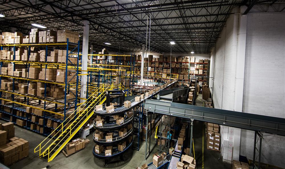 Large warehouse with mezzanines and powered and spiral conveyor systems